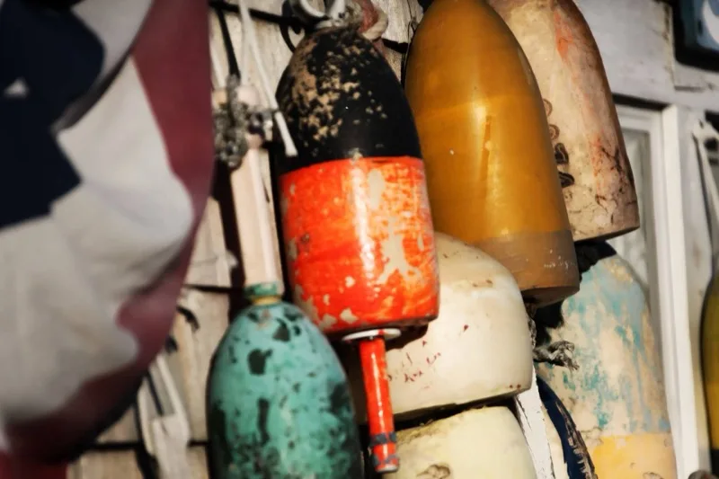Colorful Cape Cod harbor buoys at Sesuit Harbor